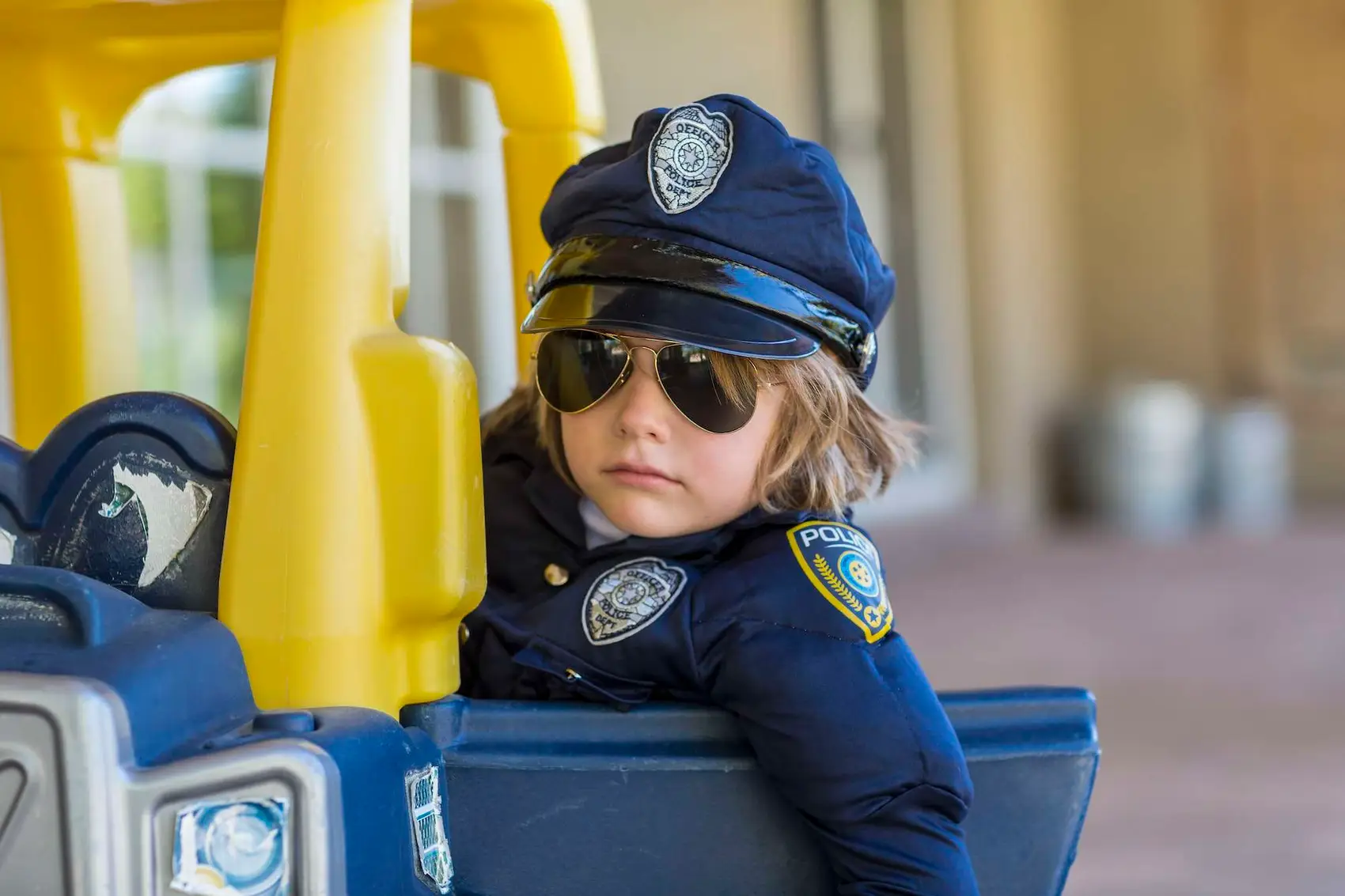 4 year old boy dressed as a police officer