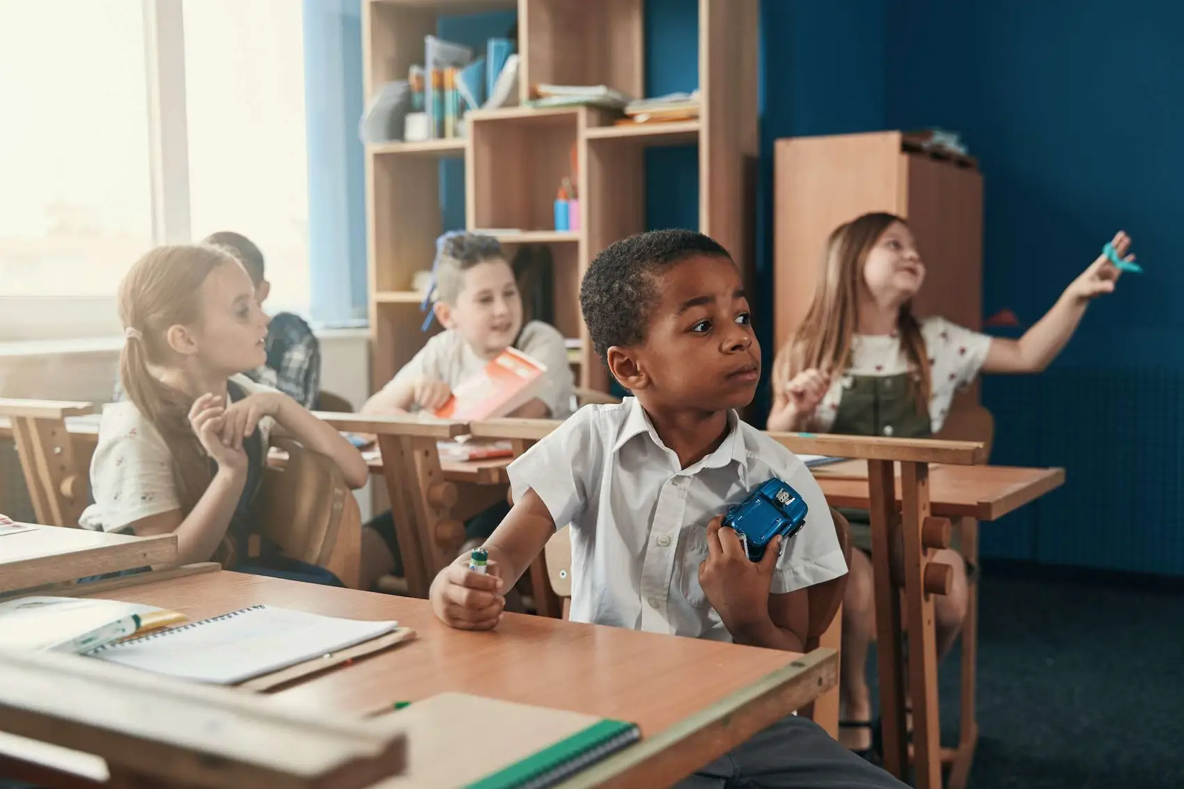 Cute kids paying attention to the teacher